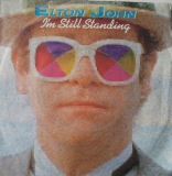 Elton John - Im still Standing / Earn White you Learn